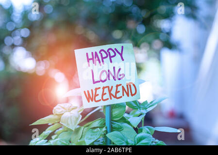 Conceptual hand writing showing Enjoy Your Weekend. Business photo text  wishing someone that something nice will happen at holiday White Sheet of Parchment  Paper with Ribbon Seal Stamp Label. Stock Photo by ©