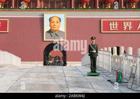 Beijing, China - October 24, 2017 : Military guard and view of The Tiananmen monument (Gate of Heavenly Peace) on Tiananmen Square in spring. Tiananme Stock Photo