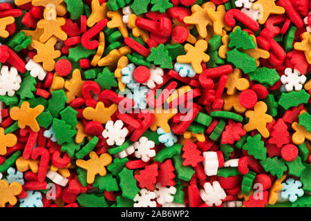 Top view on background texture of colorful Christmas candies. Stock Photo