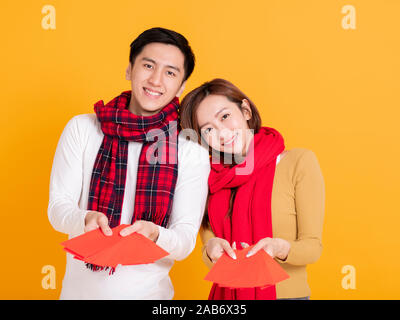 happy asian young couple celebrating  chinese new year Stock Photo