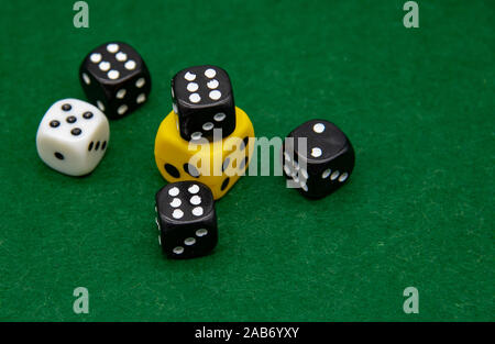 Different in color dice on a green background. Stock Photo