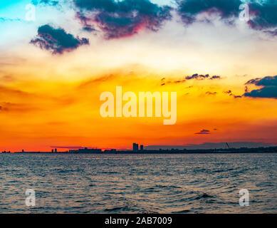 Golden blue orange sky above istanbul turkey. Seen from distance on a boat Stock Photo