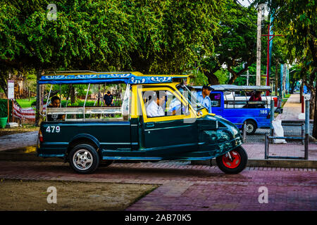 Ayutthaya, Thailand  - Oct 29, 2019:  Tuk Tuk at Ayutthaya Historical Park. It is a historic site that has been registered as a World Heritage Site fr
