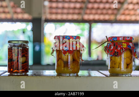 Traditional pickled fruits and vegetables in glass jars. Tocantins, Brazil. Stock Photo