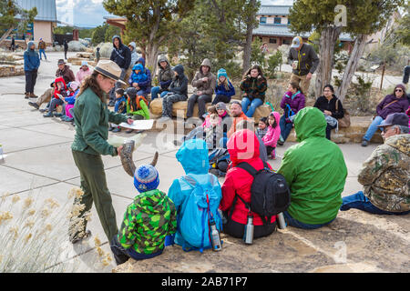 Female Park Ranger educates guests about animal antlers and horns at Grand Canyon National Park in northern Arizona Stock Photo