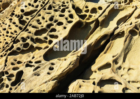 Tafoni formation, uniquely textured sandstone, cave like features and honeycomb like structures created in rock through a weathering process. Stock Photo