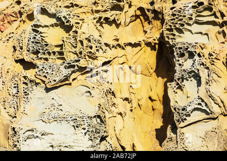 Tafoni formation, uniquely textured sandstone, cave like features and honeycomb like structures created in rock through a weathering process. Stock Photo