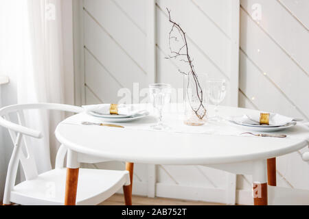 Festive table, minimalistic Christmas decor. Scandinavian interior Stock Photo