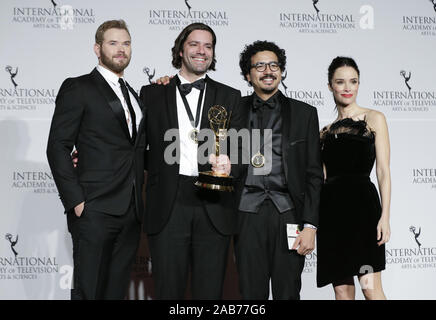 New York, United States. 25th Nov, 2019. US actor Kellan Lutz, Brazilian director Wladimir Winter Nobrega de Almeida, producer Leonardo Martin Neumann Pereira and US actress Abigail Spencer stand in the press room with the award for 'Short-Form Series' for 'Hack the City' at the 47th International Emmy Awards at the New York Hilton in New York City on November 25, 2019. Photo by John Angelillo/UPI Credit: UPI/Alamy Live News Stock Photo