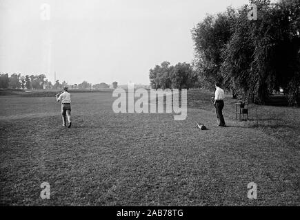 Vintage Golf Photo - A group of golfers on a golf course fairway ca. 1915-1923 Stock Photo