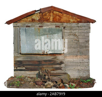 Usual noname abandoned wooden vintage  rural shed  barn for storage of firewood and agricultural tools. Isolated on white sunny autumn day shot Stock Photo