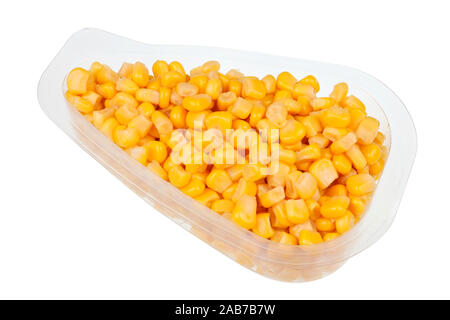 Daily food product - small marinated  sweet corn   in a transparent plastic container. Isolated with patch  on white studio macro Stock Photo