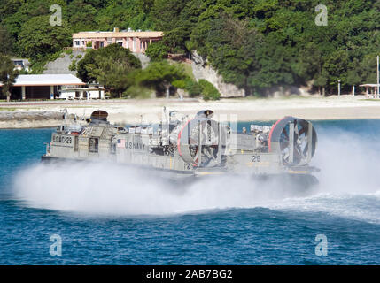 OKINAWA, Japan (Aug. 20, 2012) Landing Craft Air Cushion (LCAC) 29 transports equipment during an onload of the 31st Marine Expeditionary Unit (31st MEU) to the Bonhomme Richard Amphibious Ready Group (ARG) off the coast of White Beach Naval Facility. The ARG embarked the 31st MEU to begin conducting amphibious operations in the western Pacific. The Bonhomme Richard Amphibious Ready Group is comprised of the amphibious dock landing ship USS Tortuga (LSD 46), the amphibious assault ship Bonhomme Richard (LHD 6), the amphibious transport dock USS Denver (LPD 9), the 31st MEU, Amphibious Squadron Stock Photo