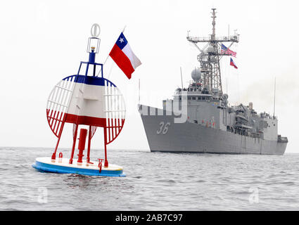 (June 6, 2012) The Oliver Hazard Perry-class guide-missile frigate USS Underwood (FFG 36) sails by a memorial buoy for the Chilean naval ship Esmeralda. Underwood is deployed to Central and South America in support of Southern Seas 2012. Stock Photo