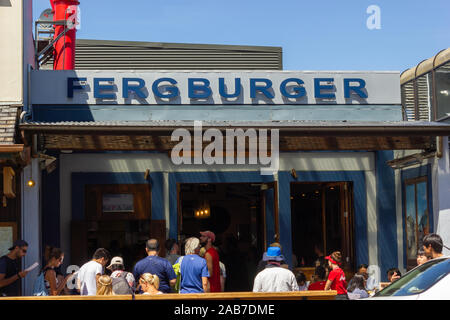 2016, February 14 - Queenstown, New Zealand, People in a queue waiting for the Fergburger the most popular restaurant in Queenstown Stock Photo