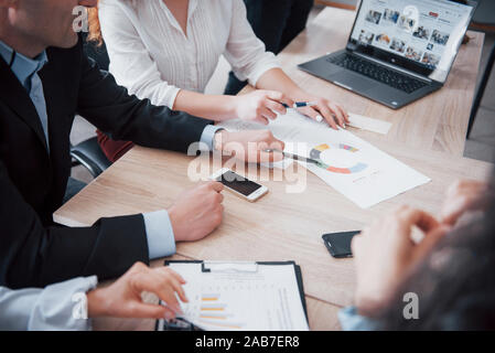 A team of creative students who create their own project in an office space. Stock Photo