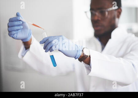 Experiments in the chemical laboratory. An experiment was carried out in a laboratory in transparent flasks Stock Photo