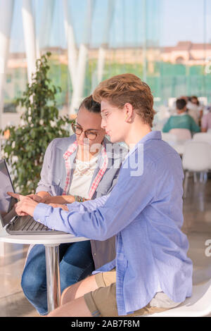 University students with a laptop in coffee shop Stock Photo