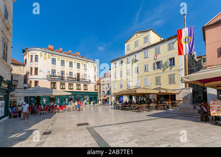 View of bars and cafes in People's Square (Pjaca), Split, Dalmatian Coast, Croatia, Europe Stock Photo