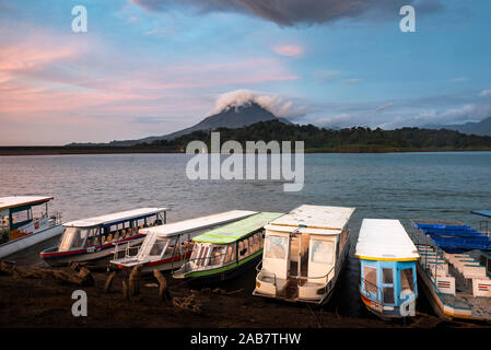 Arenal Volcano and Arenal Lake at sunset, near La Fortuna, Alajuela Province, Costa Rica, Central America Stock Photo