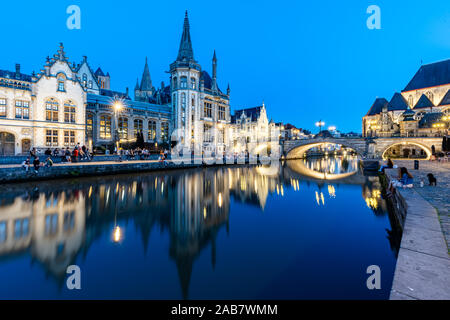 Graslei Quay in the historic city center of Ghent, mirrored in the River Lys during blue hour, Ghent, Belgium, Europe Stock Photo
