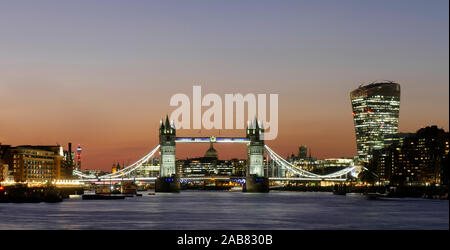 Panoramic view of Tower Bridge framing St. Paul's Cathedral with the City tower blocks at dusk, London, England, United Kingdom, Europe