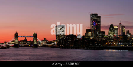 Panoramic view of Tower Bridge framing St. Paul's Cathedral with the City tower blocks at sunset, London, England, United Kingdom, Europe Stock Photo