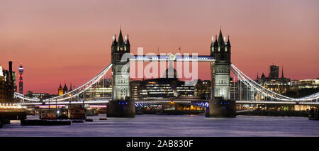 Panoramic view of Tower Bridge framing St. Paul's Cathedral at dusk, London, England, United Kingdom, Europe Stock Photo