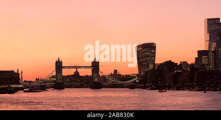 Panoramic view of Tower Bridge framing St. Paul's Cathedral with the City tower blocks at sunset, London, England, United Kingdom, Europe Stock Photo