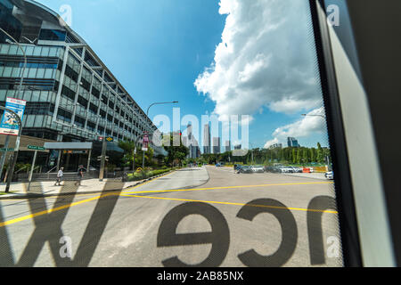 Various Singapore street scene, cityscape seen from a moving public bus. Office buildings, skyscraper, shopping malls and me Stock Photo