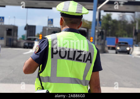 Cassino, Italy - 11 September 2013: A traffic police officer engaged in checks at the exit of the A1 motorway Stock Photo