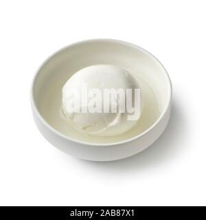 Fresh white Italian mozzarella cheese in a bowl with water close up isolated on white background Stock Photo