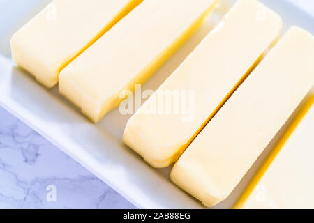 Organic sticks of butter at the room temperature. Stock Photo