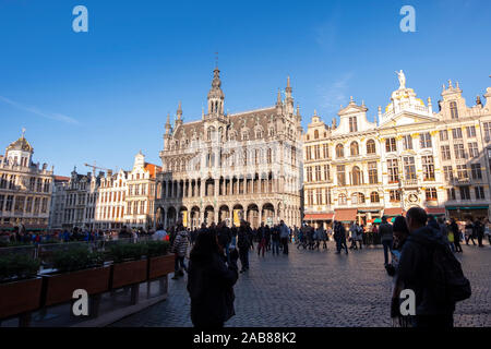 BRUSSELS, BELGIUM, November 10 2019: Tourists visiting the main square Grand Place on a sunny autumn day Stock Photo