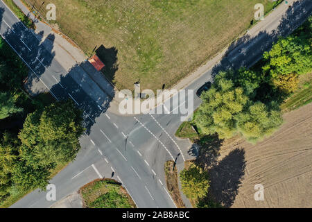 Vertical aerial photograph of an intersection with markings of stop lines and of a crossing for cyclists Stock Photo