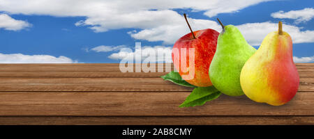 Pears and apples on wooden background Stock Photo