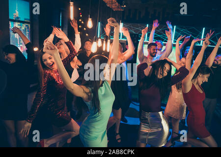 Lets party hard. Portrait of cheerful positive people and bachelorette want have perfect event after studying go nightclub enjoy music dance scream Stock Photo