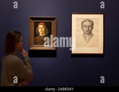 National Gallery, London, UK. 26th November 2019. Young Bomberg and the Old Masters exhibition by British modernist artist David Bomberg (1890-1957) are displayed alongside National Gallery pictures that influenced him. Image (left): Sandro Botticelli. Portrait of a Young Man, probably about 1480-5. National Gallery; (right): David Bomberg. Self Portrait, 1913-14. National Portrait Gallery, London. Credit: Malcolm Park/Alamy Live News. Stock Photo