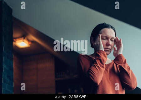 Woman with severe migraine headache, selective focus Stock Photo
