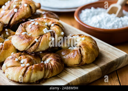 Close up view of a fresh batch of Swedish cinnamon buns with pearl sugar ready for eating. Stock Photo