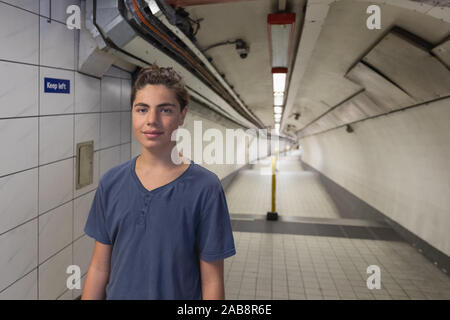 Portrait of a young teenager in the subway tunnel in London. Copy space