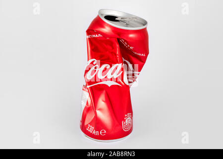 KIEV, UKRAINE - 25 June 2019: 330ml Coca cola crumpled can on white background. Stock Photo