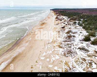 Aerial view of the Baltic Sea shore line near Klaipeda city, Lithuania. Beautiful sea coast on chilly winter day. Winter on Baltic sea. Stock Photo