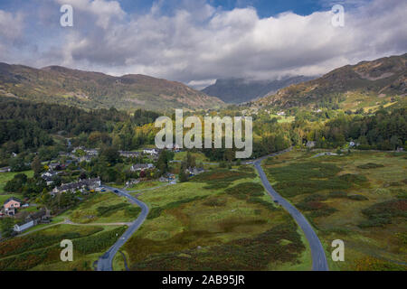Drone shoot over Elterwater village and Langdale Pikes in Lake District National Park, UK Stock Photo