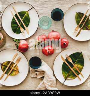 Fall table setting with leaves for family gathering, square crop Stock Photo