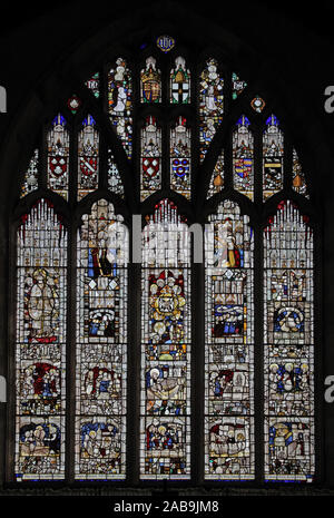 A 16th century stained glass window, Greystoke, Cumbria. The east window depicts a number of Christian themes, various heraldic themes and in the bott Stock Photo