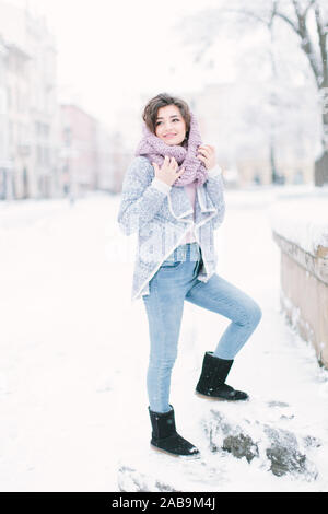 jeans, blue sweater and uggs walks 