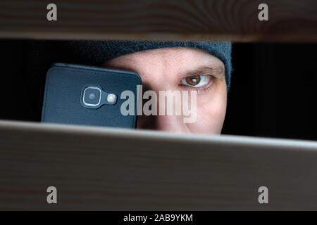 Private detective with camera spying on city street Stock Photo - Alamy