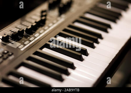 Piano keys of electronic synthesizer close up. Selective focus. Stock Photo