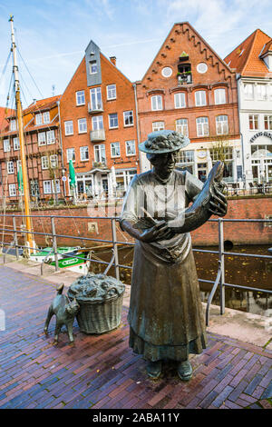 Stade, Germany - November 11, 2019. Statue of woman with the fish in the hand Stock Photo